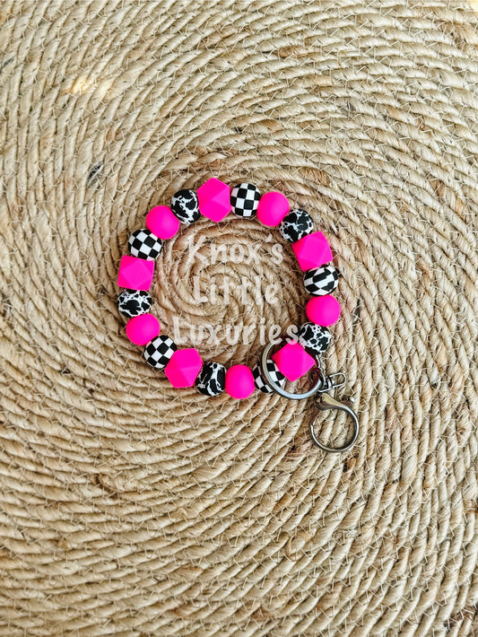 Neon Pink Checkered Cow Wristlet